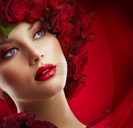 Beautiful Fashion Girl with red makeup and Roses. Hairstyle