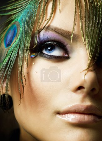 Beautiful Fashion Girl face. Peacock Makeup