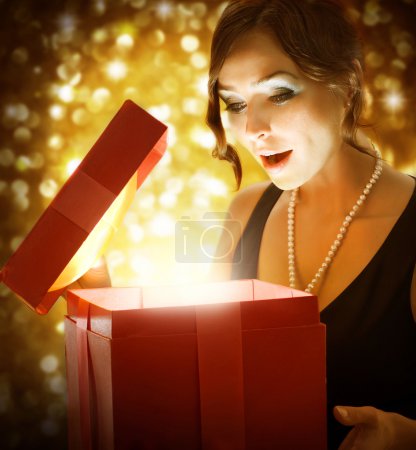 Christmas or New Year Gift. Surprised Woman