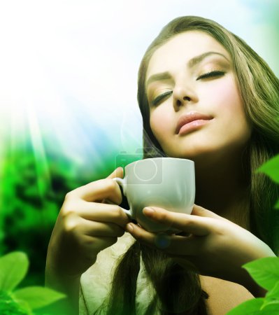 Beautiful Girl Drinking Healthy Green Tea. Healthcare or Herbal