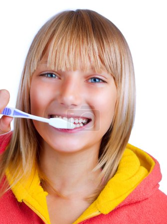 Healthy Teeth.Teenage Girl brushing her teeth