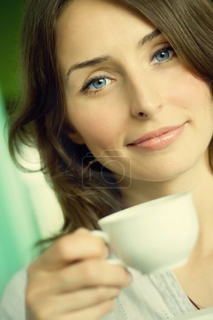 Beautiful Young Woman Drinking Coffee