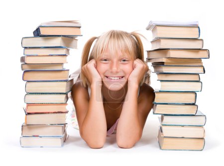 Back To School Concept. School Girl Between The Stacks Of Books