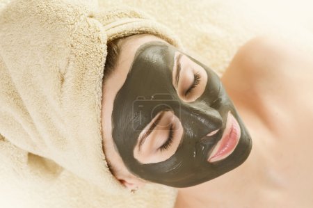 Spa. Mud Mask On The Woman's Face