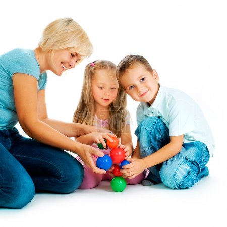 Children playing on the floor. Educational games for kids
