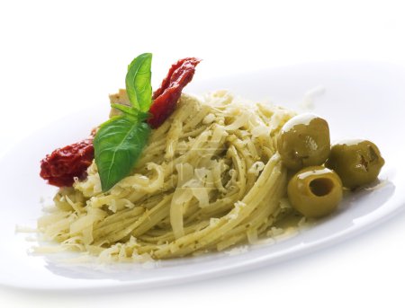 Italian Pasta With Pesto Sauce, Dried Tomato, Olives, Basil And