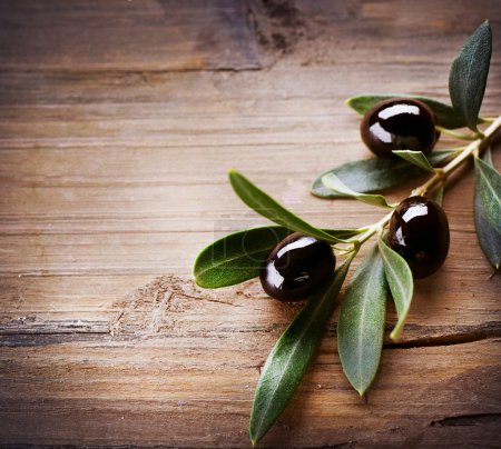 Olives over Wood Background