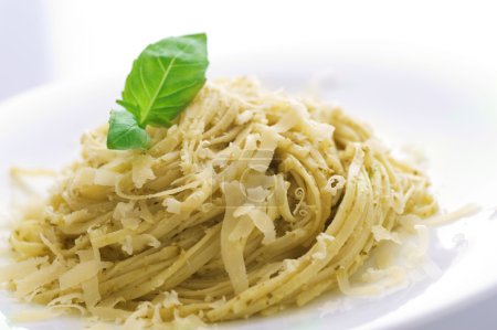 Italian Pasta With Pesto Sauce, Basil And Parmesan Cheese