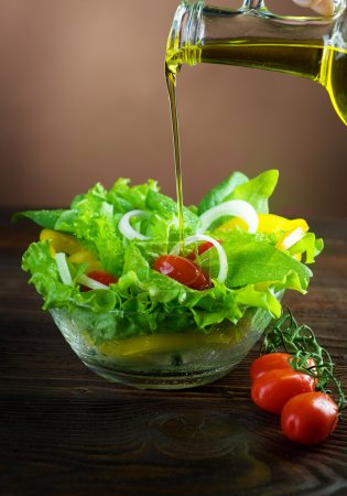 Healthy Salad and Pouring Olive Oil