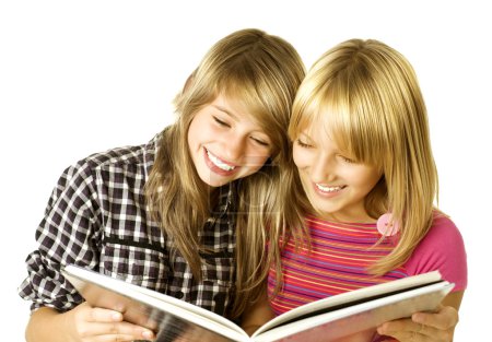 Two Teenage Girls reading The Book.Education
