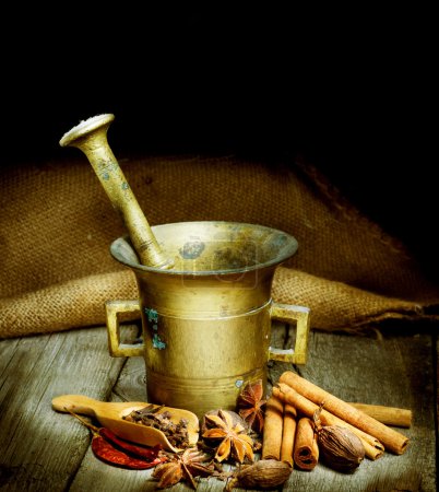 Spices And Mortar Isolated On Black. Vintage Styled