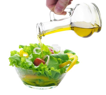 Healthy Vegetable Salad And Pouring Oil