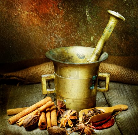 Spices And Antique Mortar With Pestle