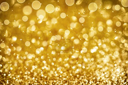 Christmas Golden Glittering background.Holiday Gold abstract tex