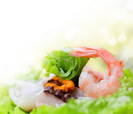 Healthy Seafood Salad with shrimps, octopus and mussels
