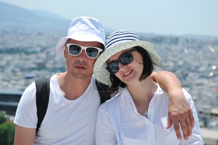 Happy young couple tourists in greece