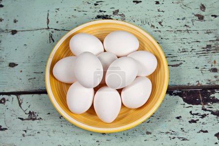 White eggs on a yellow plate
