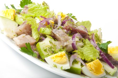 Herring salad, apples and eggs