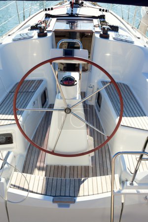 Boat stern with big steering wheel sailboat