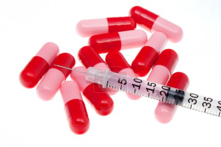 Syringe with Red Pills