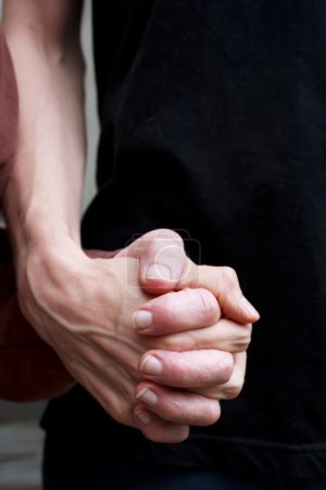 Caregiver holding senior lady's hand