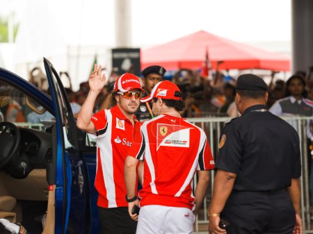 SEPANG, MALAYSIA - APRIL 10: Fernando Alonso and Felipe Massa (F
