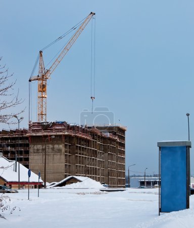 Tower crane, buildind and publicity board