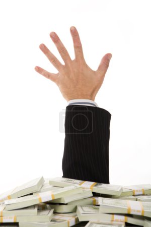 A male hand stretching out of money heap
