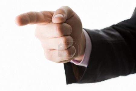 Photo of human hand with forefinger pointing aside