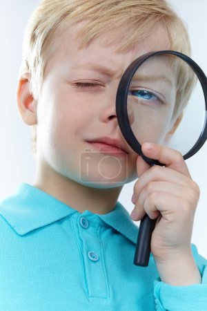 Looking through magnifying glass