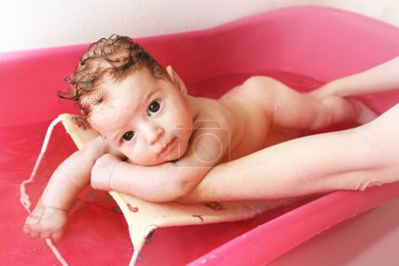 Baby is having a bath