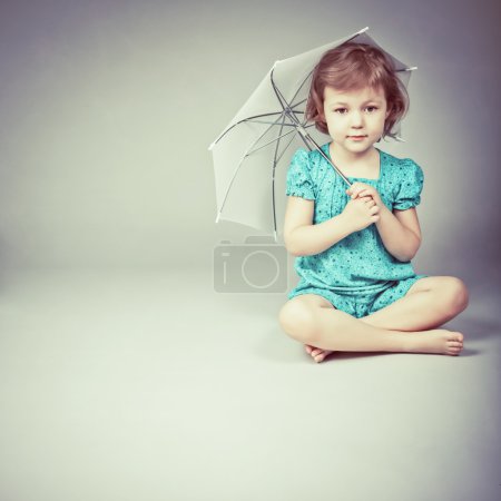 Beauty a little girl with umbrella
