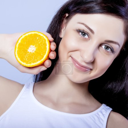 Beautiful girl with oranges