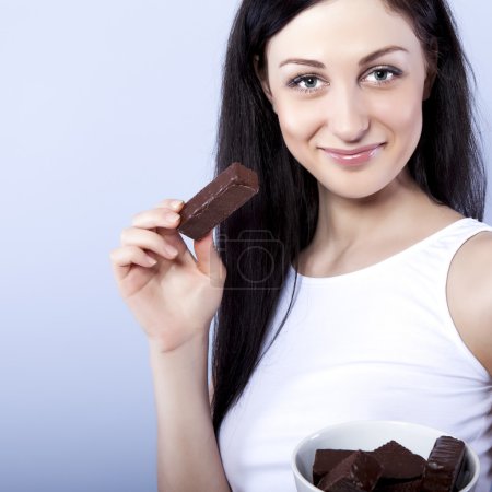 Portrait of beautiful woman with a chocolate
