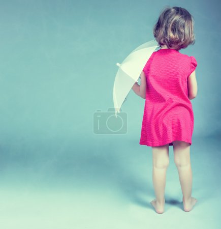 Pretty little girl with umbrella
