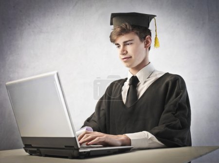 Grad student using a laptop
