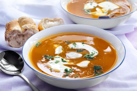Bowls of Pumpkin Soup with Bread