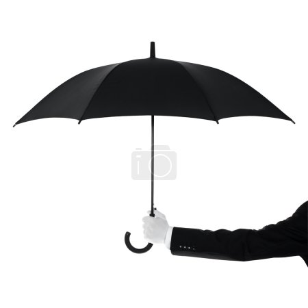 Butler holding an umbrella