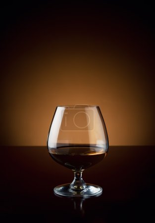 Glass of cognac with copy space