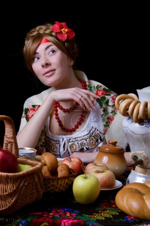 Russian woman drinking tea with samovar