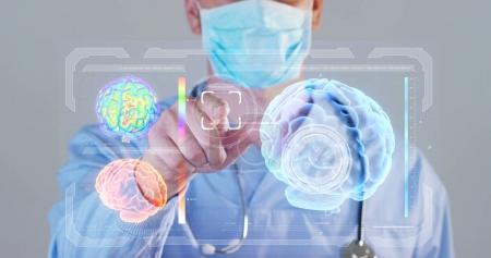 A futuristic doctor, a surgeon, looks into a technological digital holographic monitor, a brain hologram, a medical mask, a blue robe. Concept futuristic medicine, doctors, laboratory, future, science