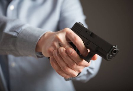 Man holding pneumatic gun