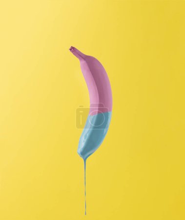 Pink banana with dripping blue paint 