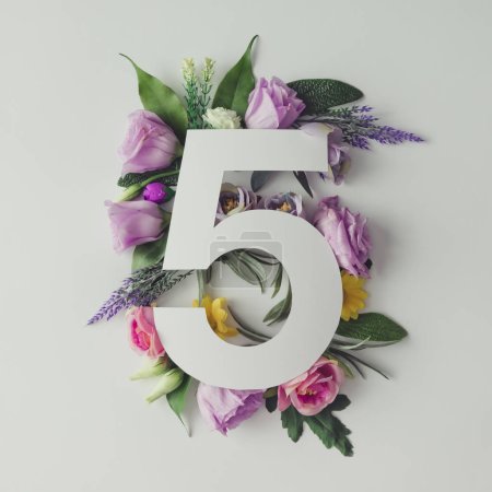 Creative layout with flowers and number five