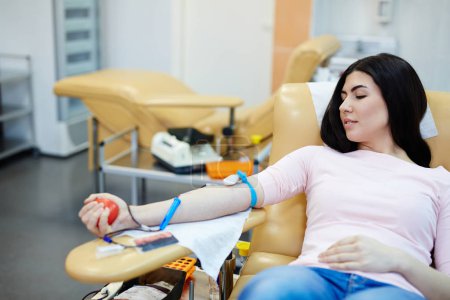 woman giving her blood 