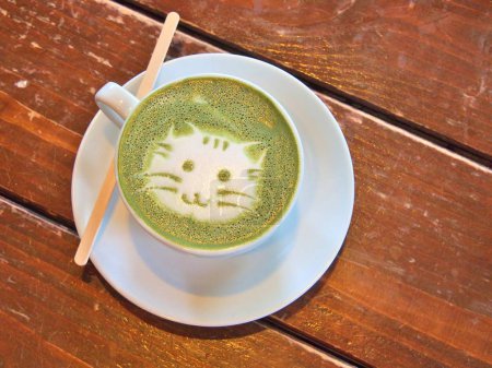 Matcha green tea latte with latte art 'Cat face'
