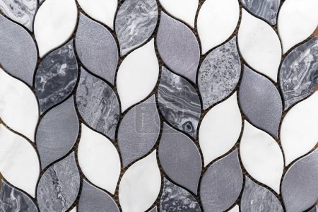 Marble gray and white tile mosaic in the form of a pigtail.