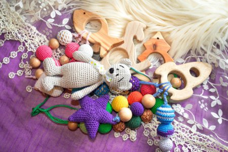 Pile of toys on a rug, lace and fur background