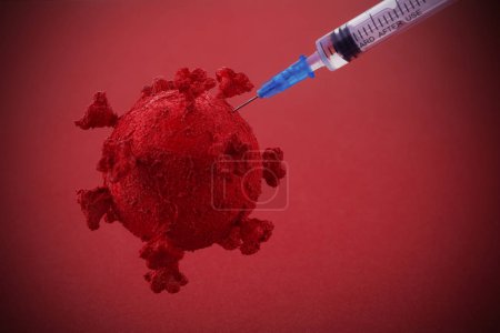 Corona virus Vaccine concept with syringe and virus background. Vaccine Concept of fight against coronavirus.