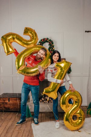 couple with new year balloons